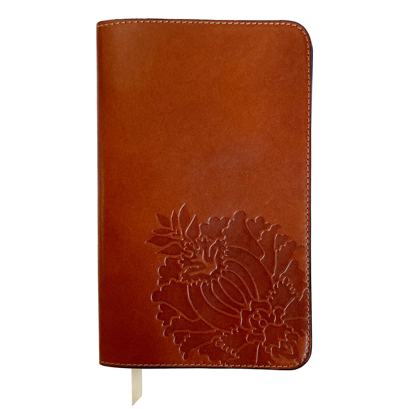 Leather notebook cover with floral embossed design